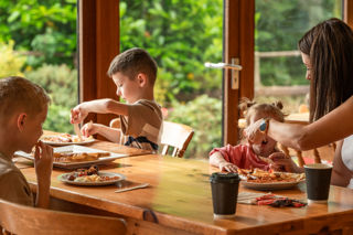 An image of mum feeding her toddler breakfast.