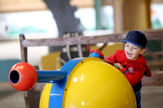Children playing with ball cannons at Cantref Adventure Farm.